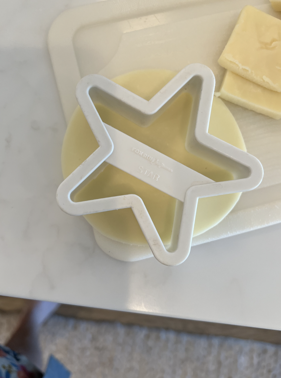 using cookie cutters to make cheese into stars