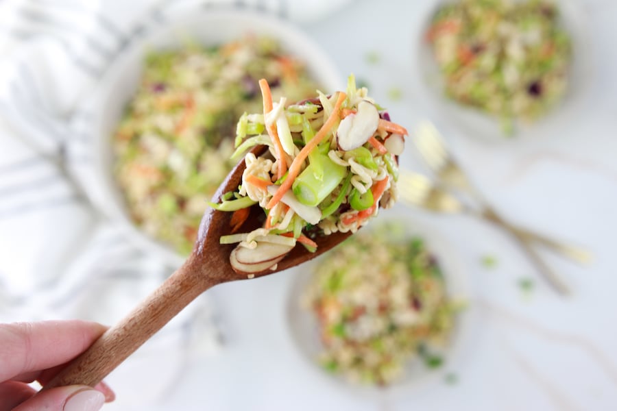 broccoli slaw mix close up on wooden spoon