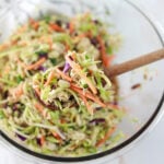 mixing ingredients in glass bowl with a wooden spoon