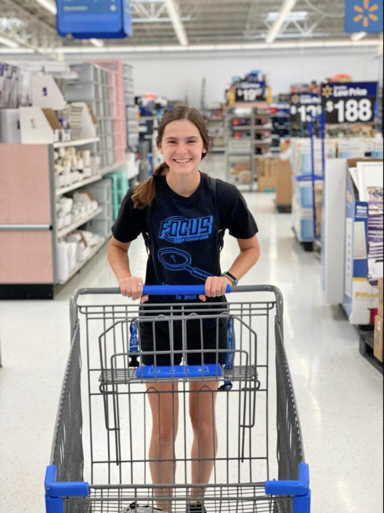 girl with grocery cart in a walmart 