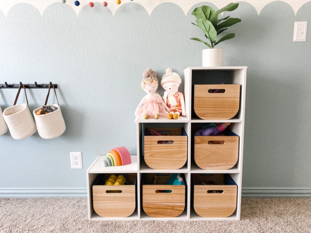 organizing toys in kids play room 