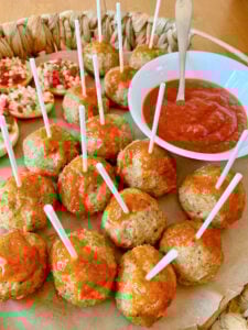 Delicious chicken parm meatball pops appetizer with marinara dipping sauce