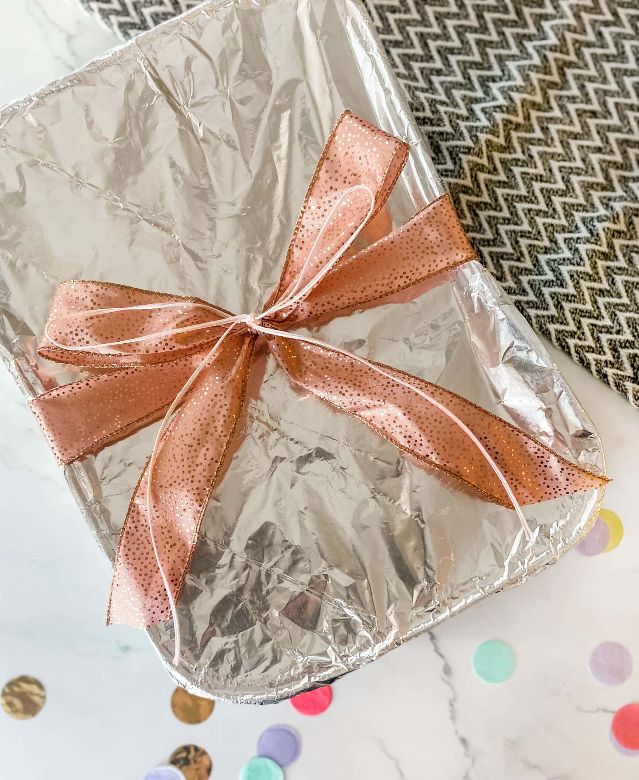 wrapping a casserole dish with a bow