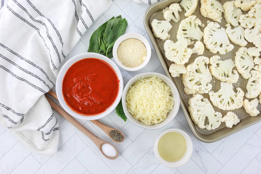 ingredients in white bowls for cauliflower parmesan