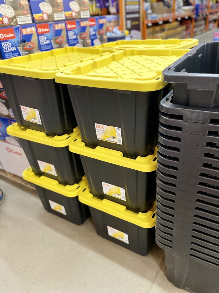 various green and yellow storage totes in store