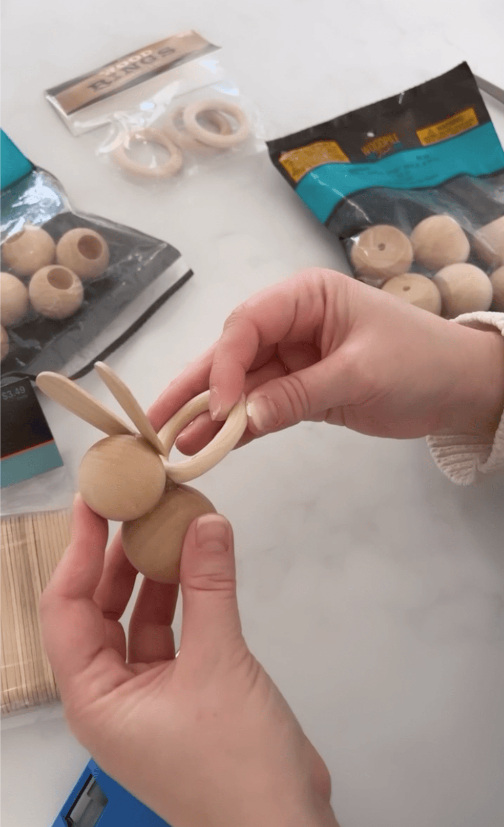 attaching ring to wooden bunny for napkin holder 