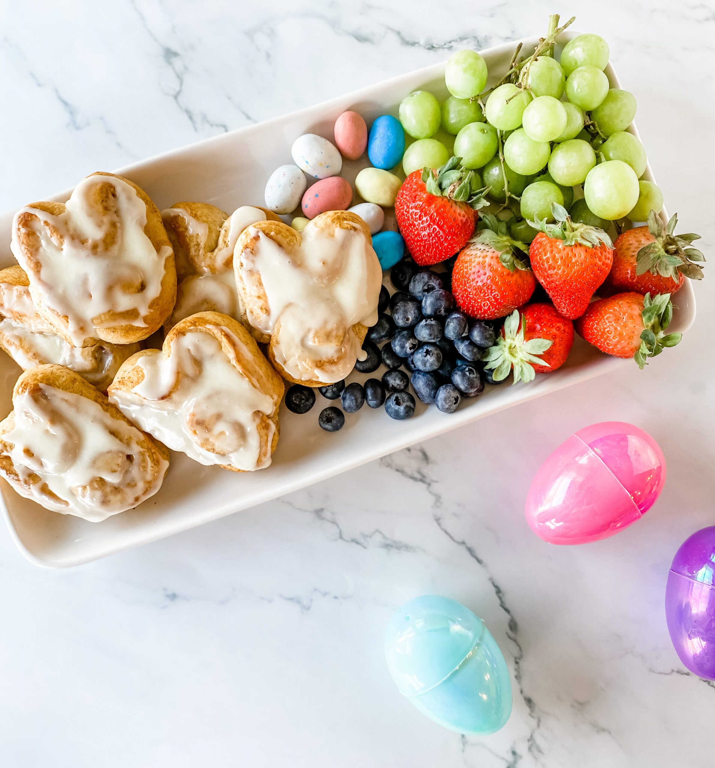 Cinnamon Roll Bunnies on platter with fruit