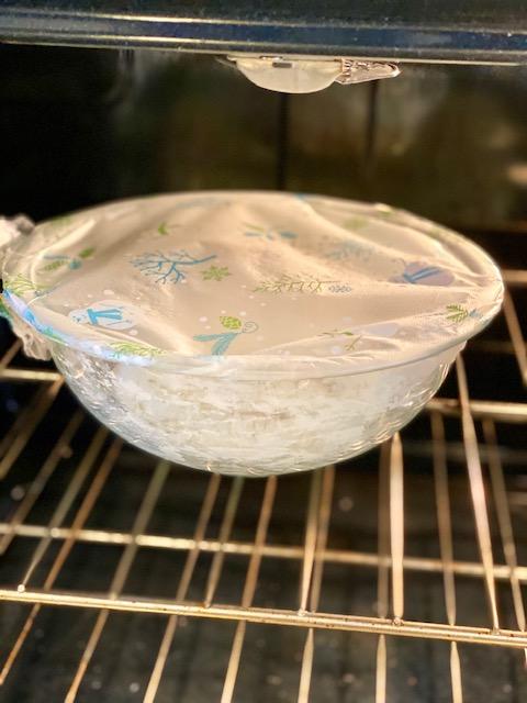 artisan bread dough rising in warm location