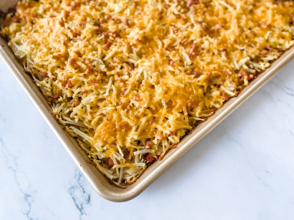 Shhet Pan Hashbrowns with ham and cheese in baking pan