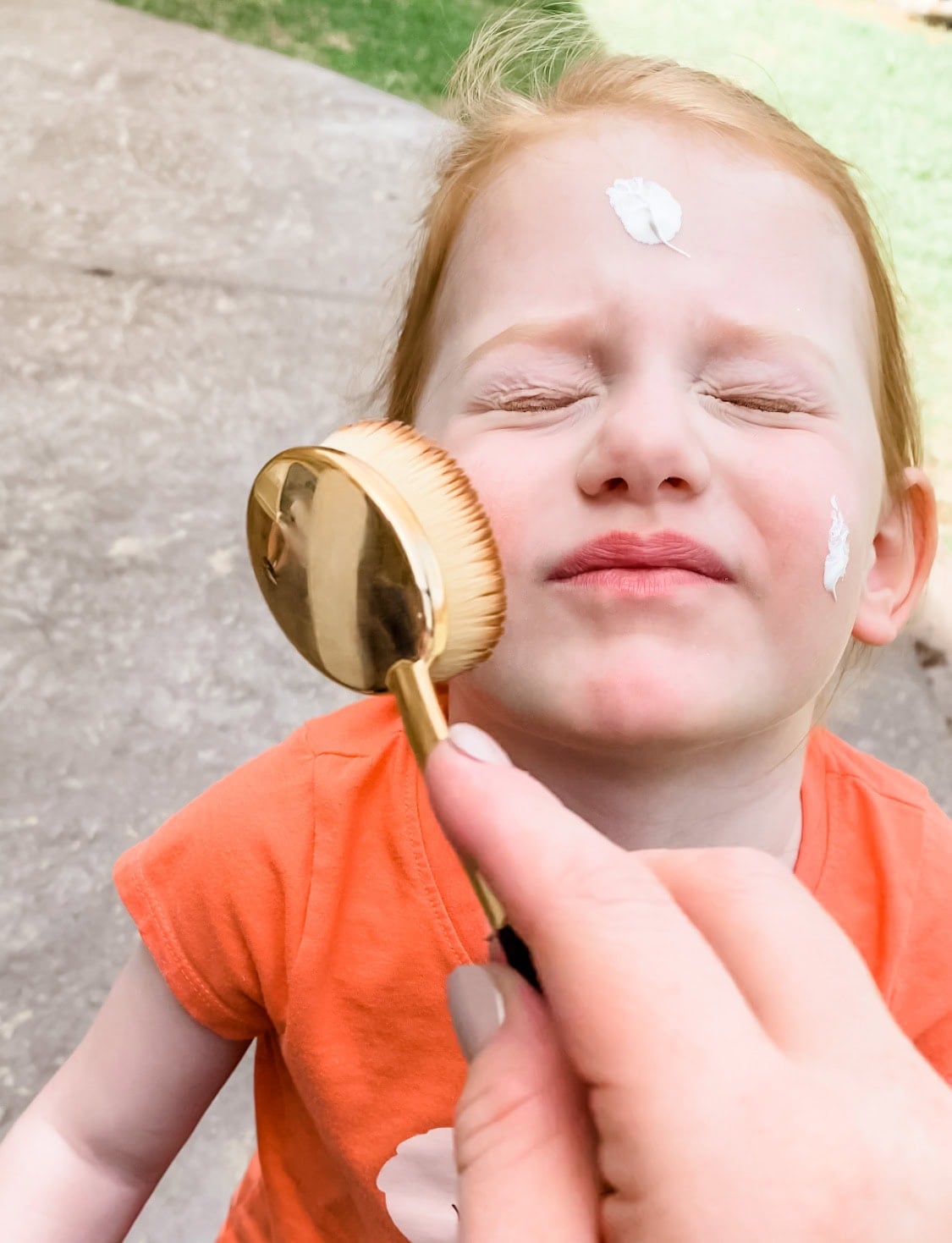 sunscreen applied with makeup brush 