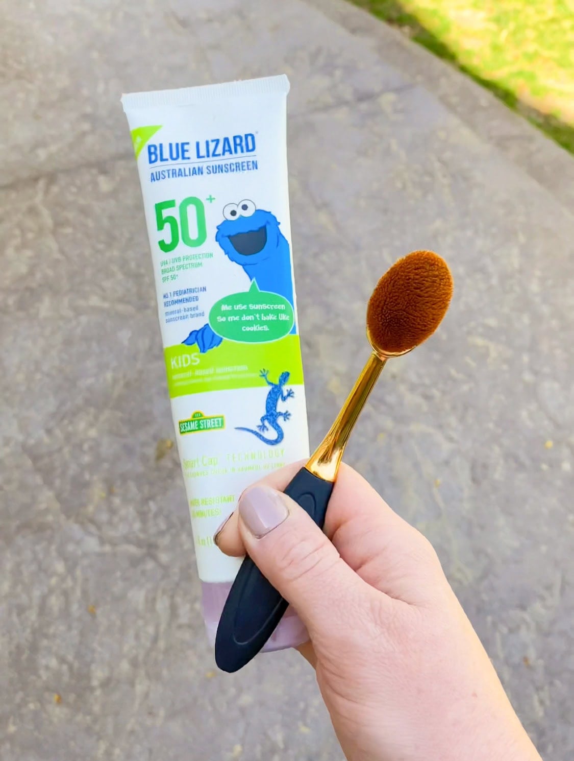 applying sunscreen with makeup brush 