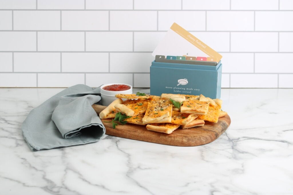Cheesy Flatbread finished on platter with recipe box