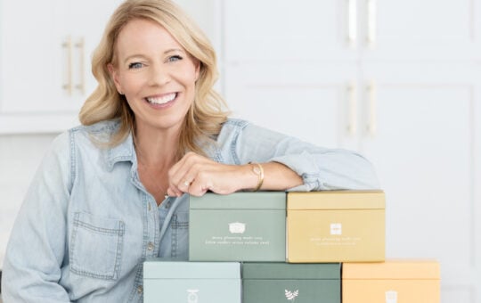 Laurie with 9 menu boxes whole foods