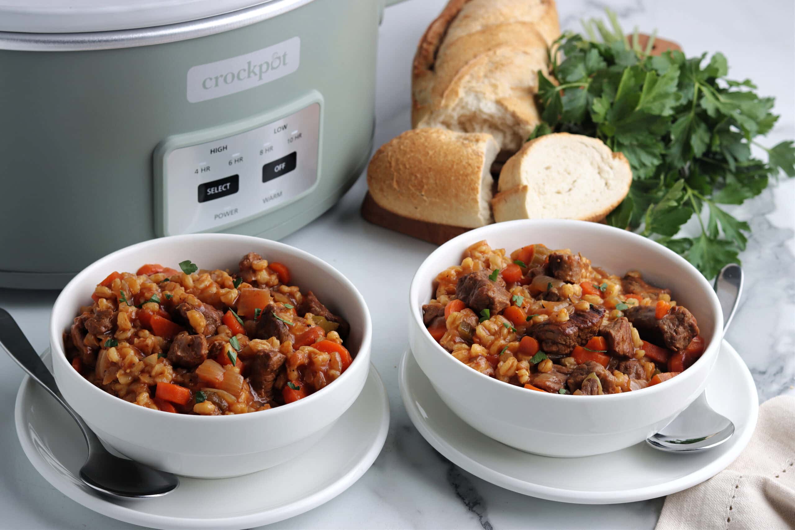 Vegetable Beef & Barley Soup in bowls with bread