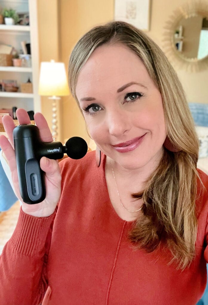 mary-holding-massage-gun massage gun