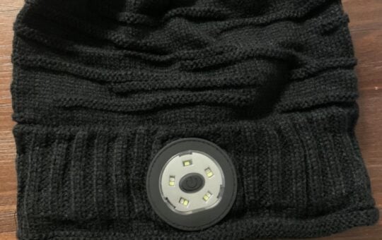 black beanie with light on front
