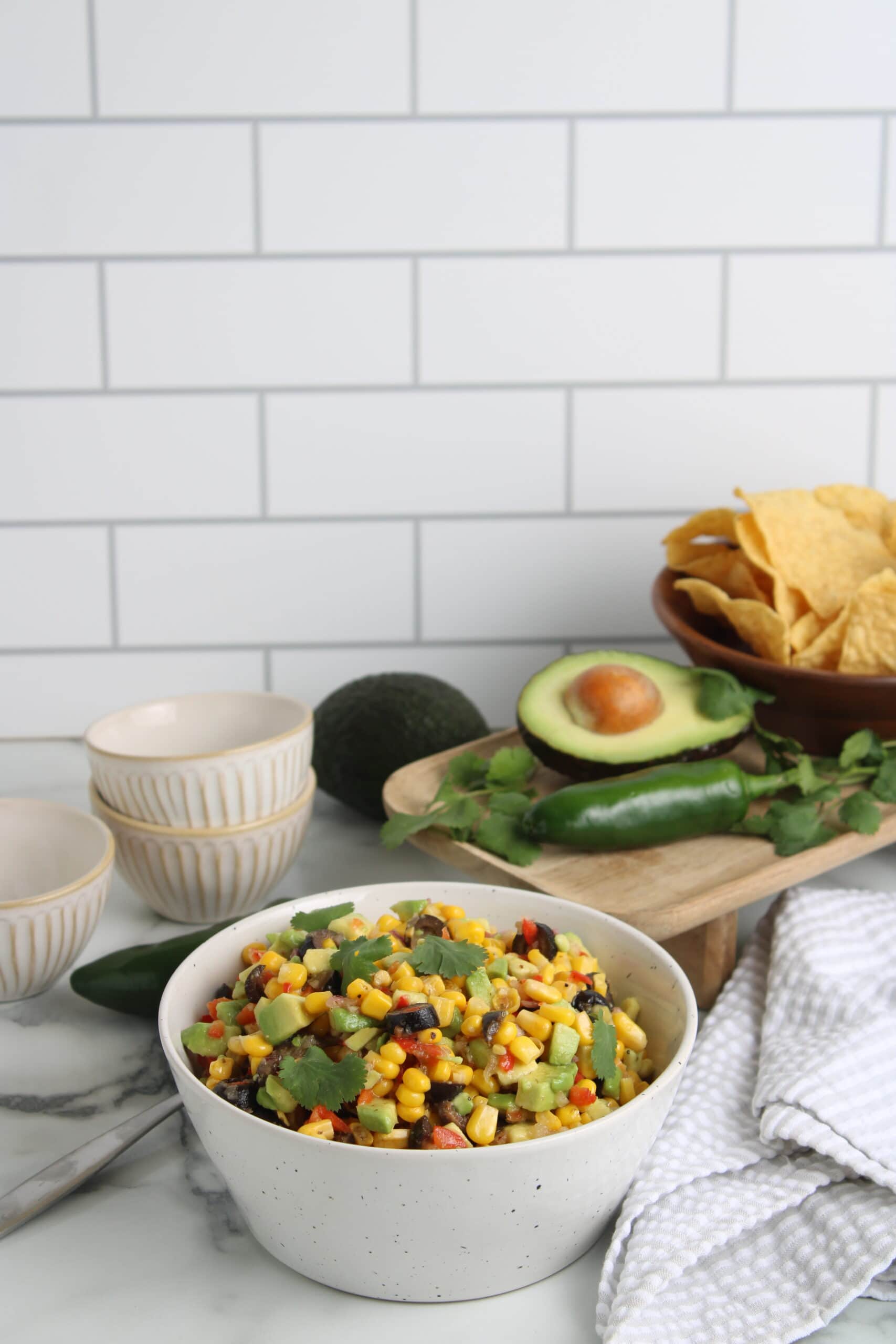 Awesome Avocado and Corn Salsa finished in white bowl