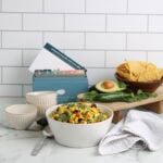 Awesome Avocado and Corn Salsa on counter with recipe box