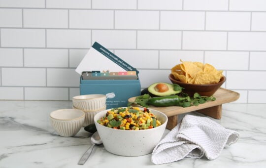 Awesome Avocado and Corn Salsa on counter with recipe box