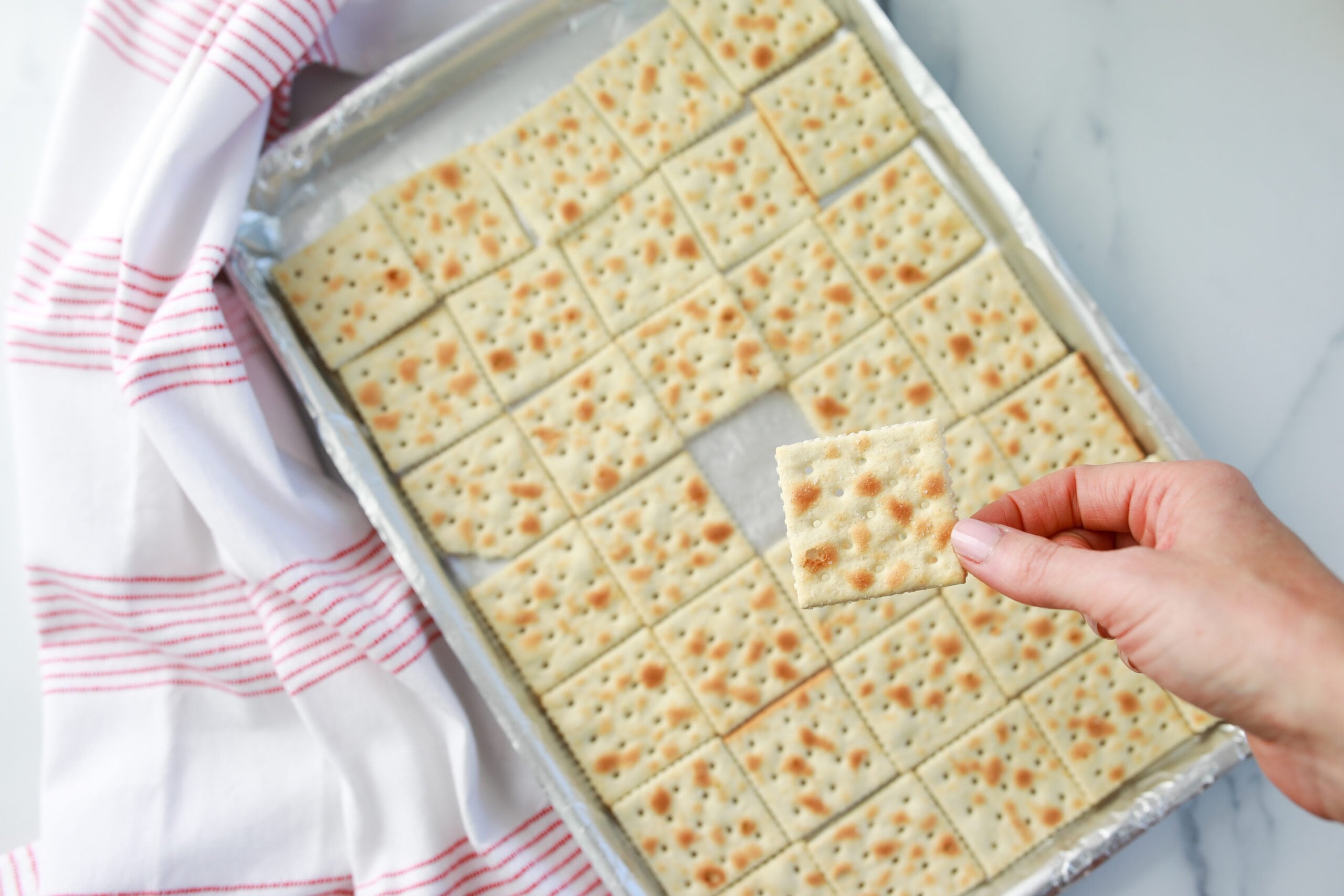 lining saltines on baking tray for saltine cracker candy