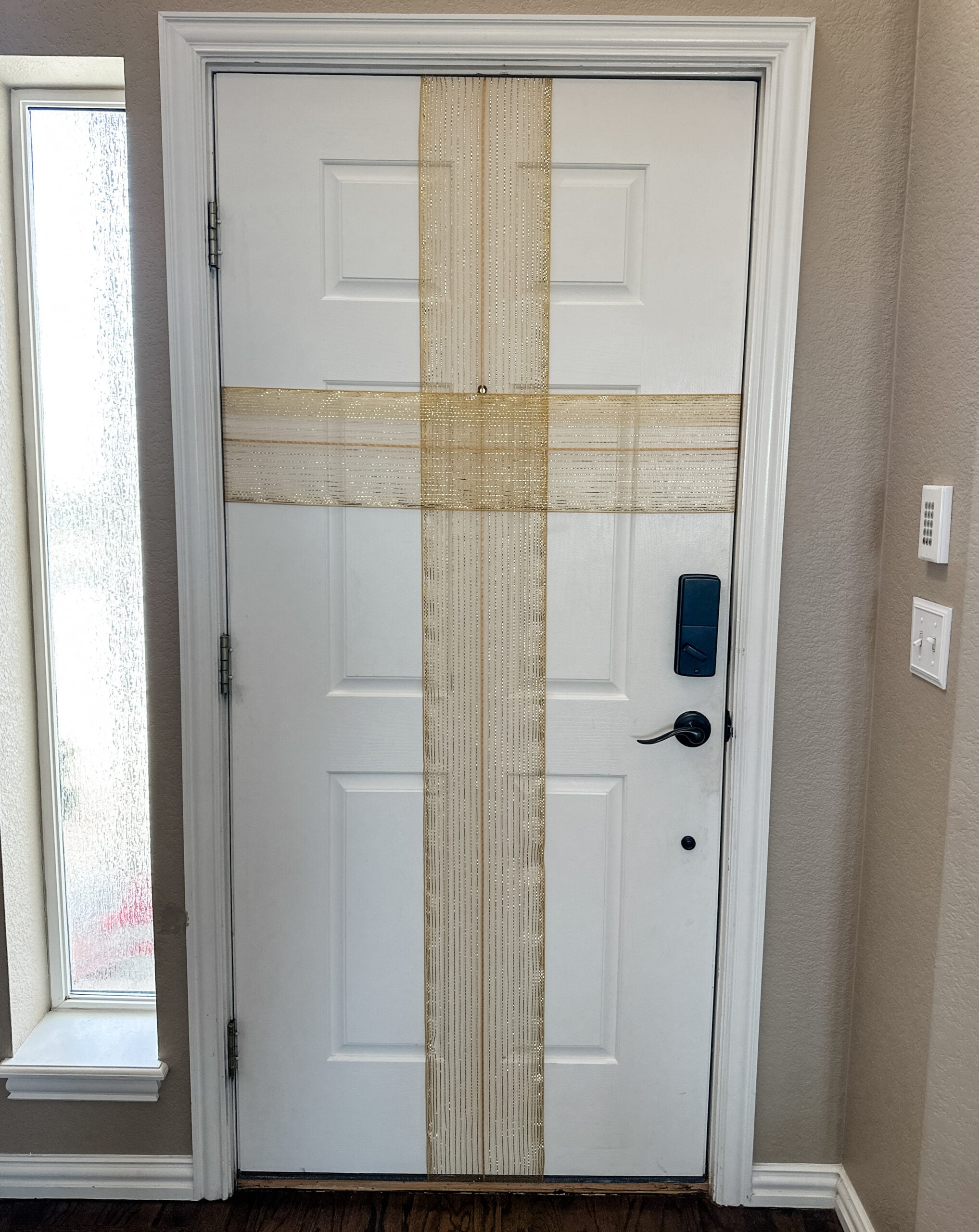 how to decorate a door for christmas with ribbon and bow