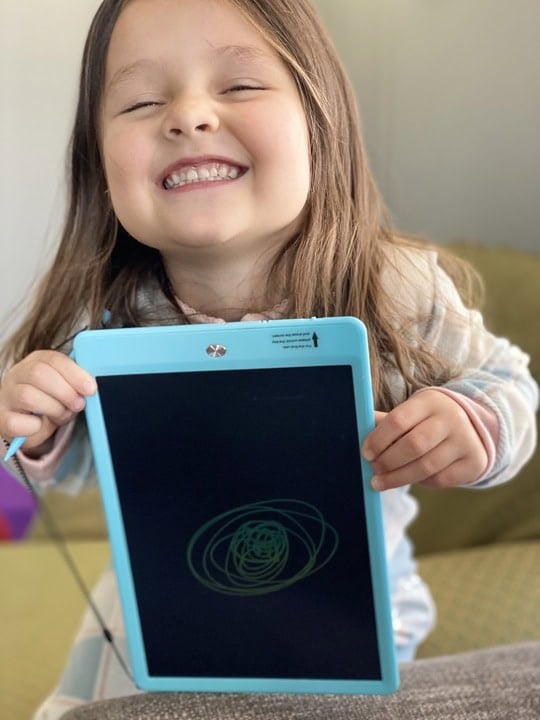 LCD writing tablets in hand of small child