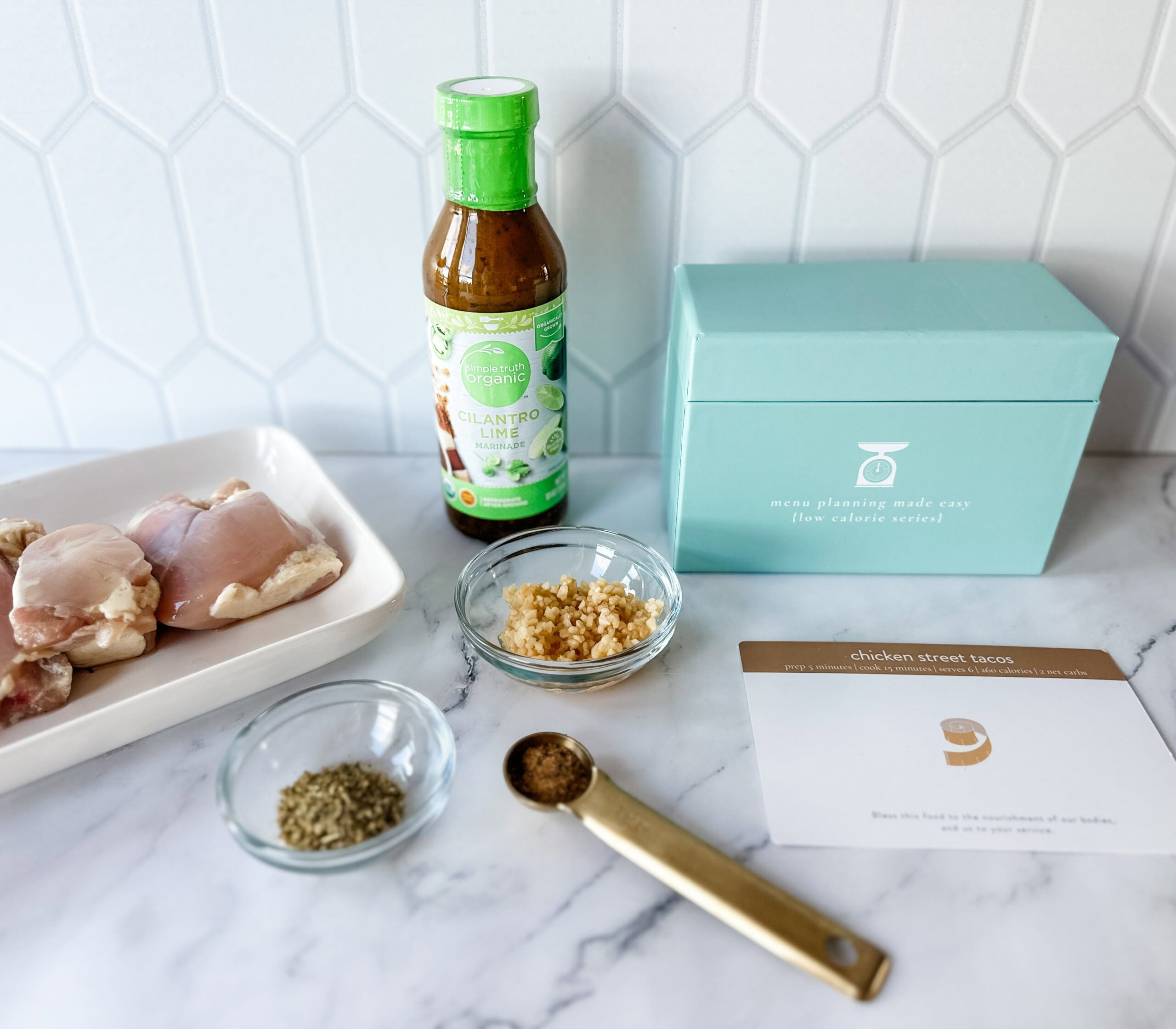 chicken street taco ingredients on countertop with recipe box