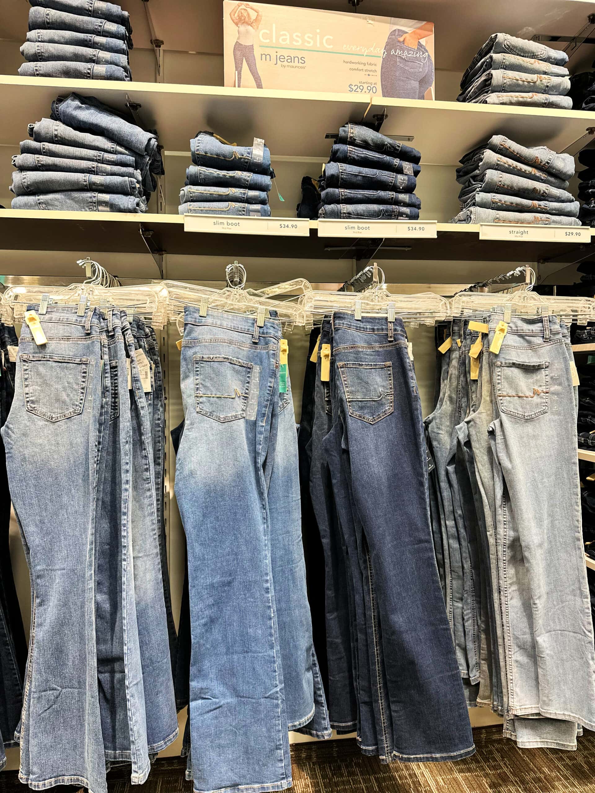 maurices jeans hanging in store