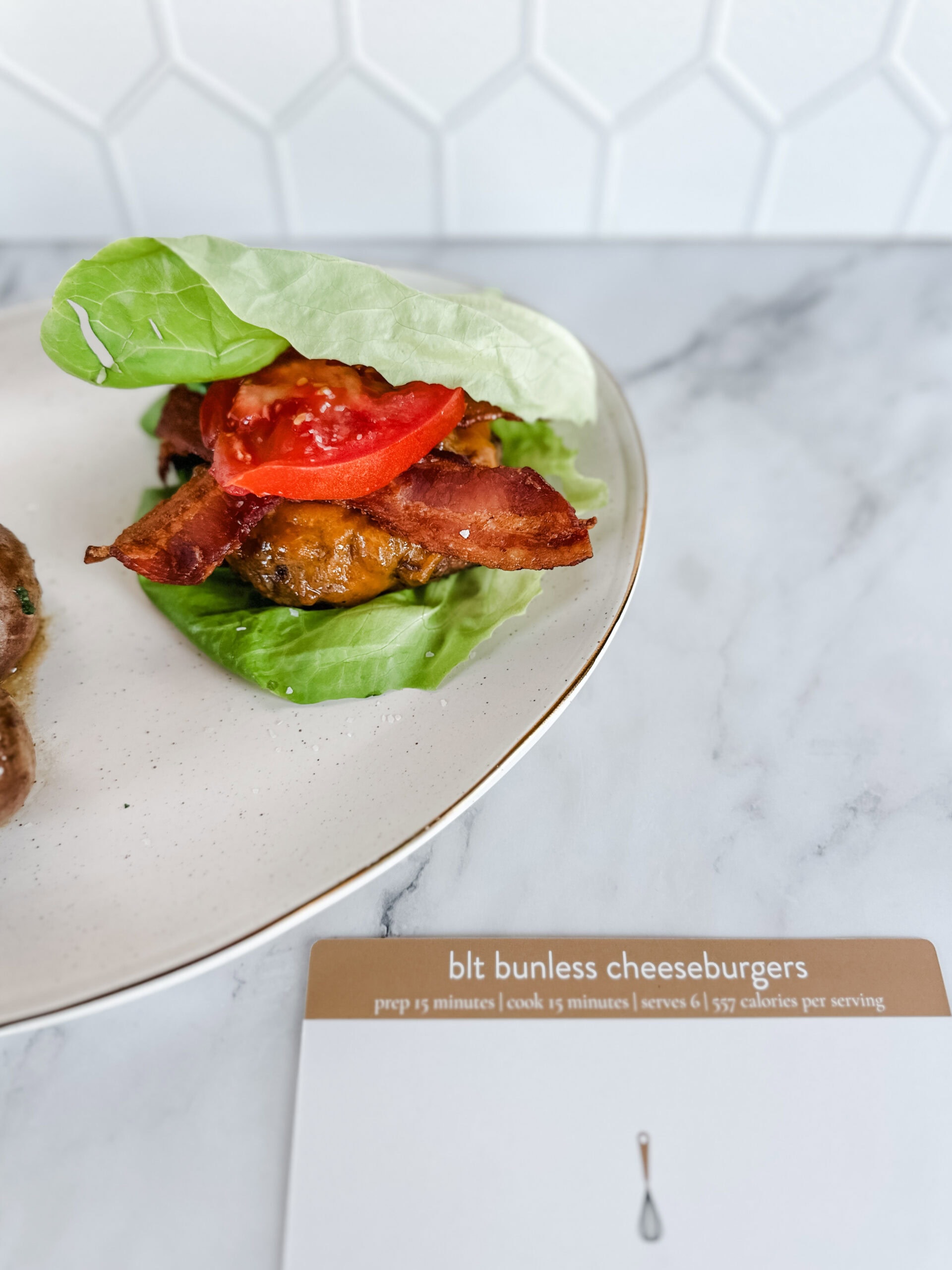 lettuce wrapped burger on plate with recipe card