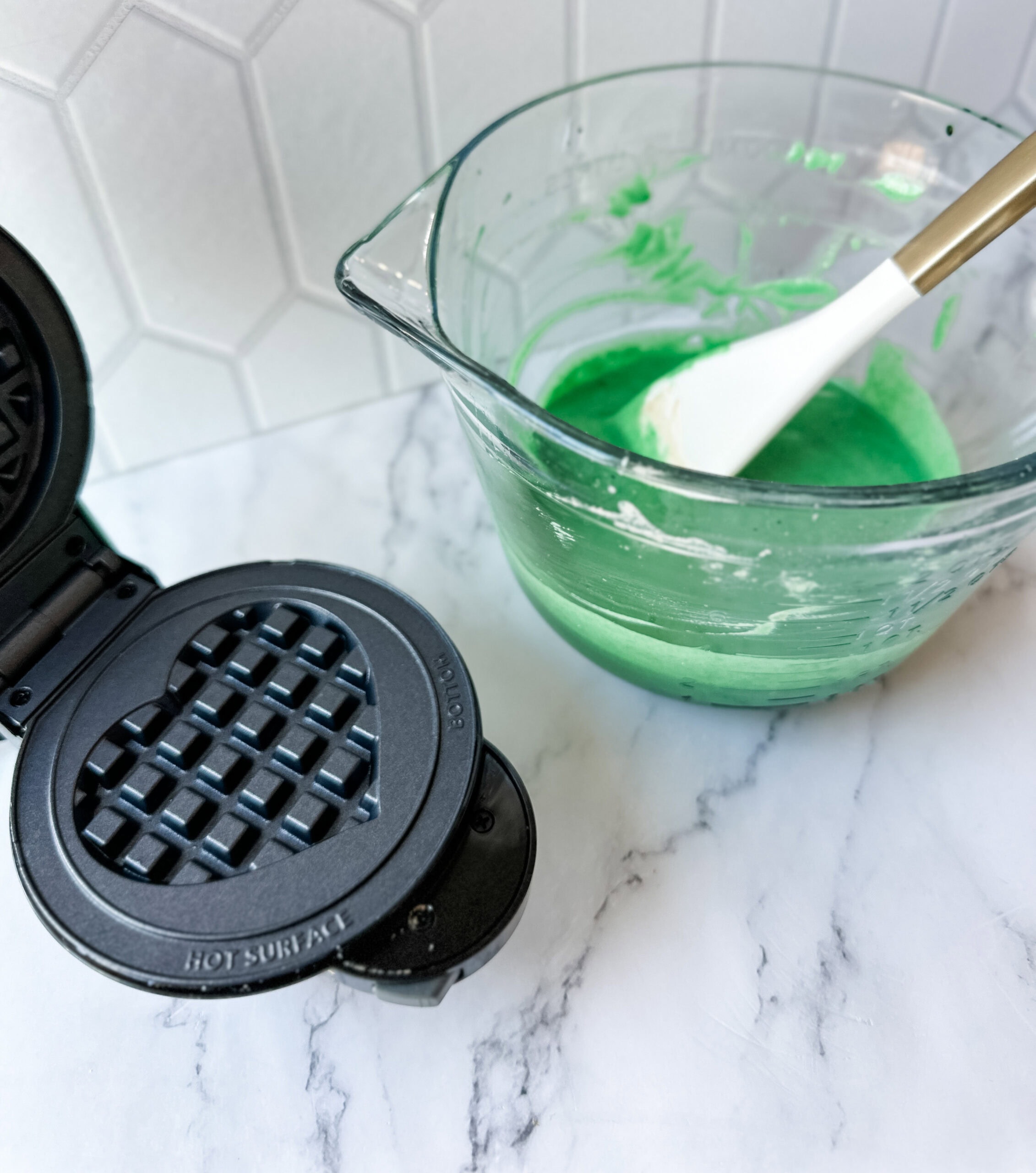 making st. patrick's day waffles with green batter 