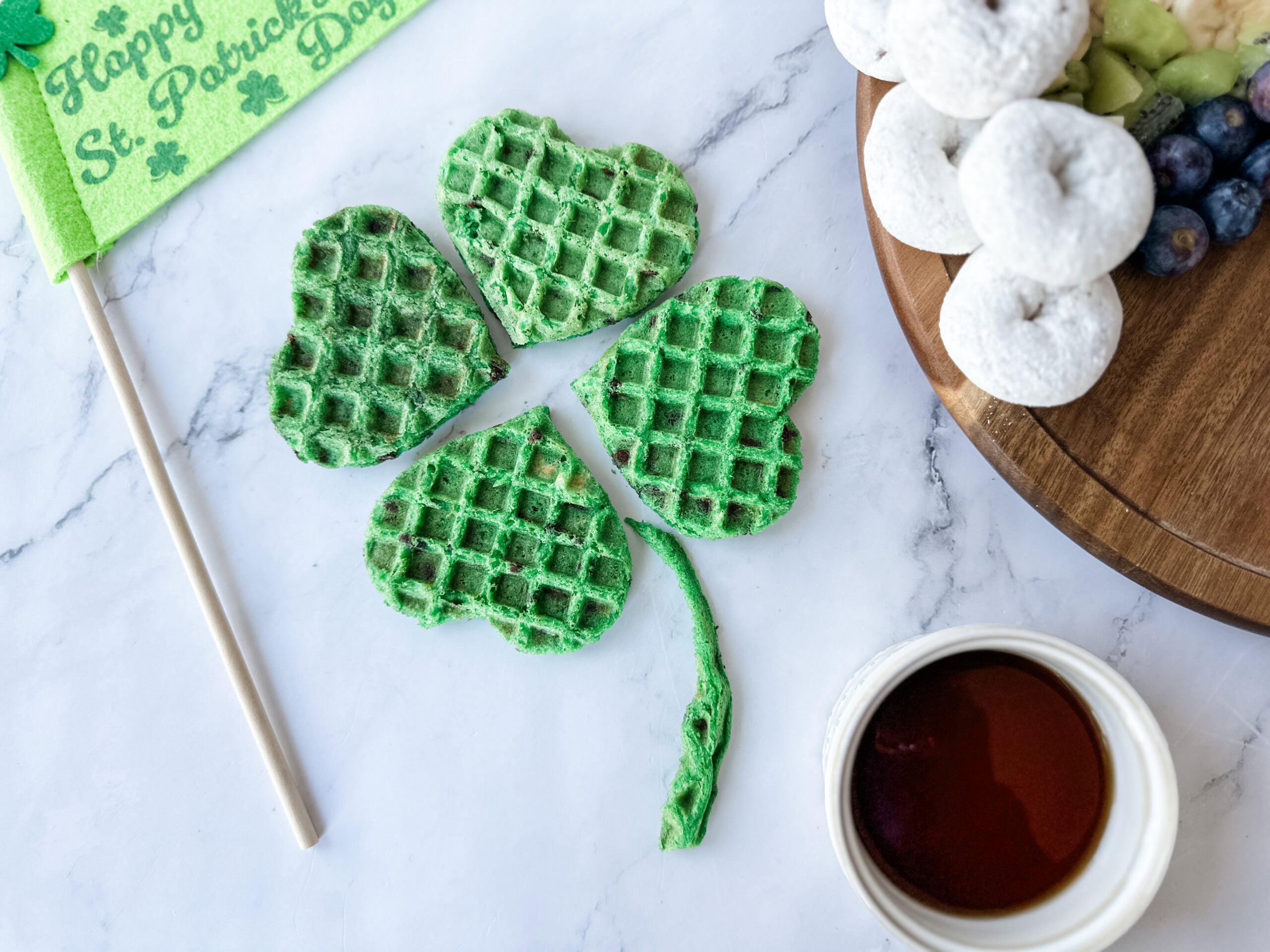 4 leaf clover waffles dyed green for st. patrick's day 
