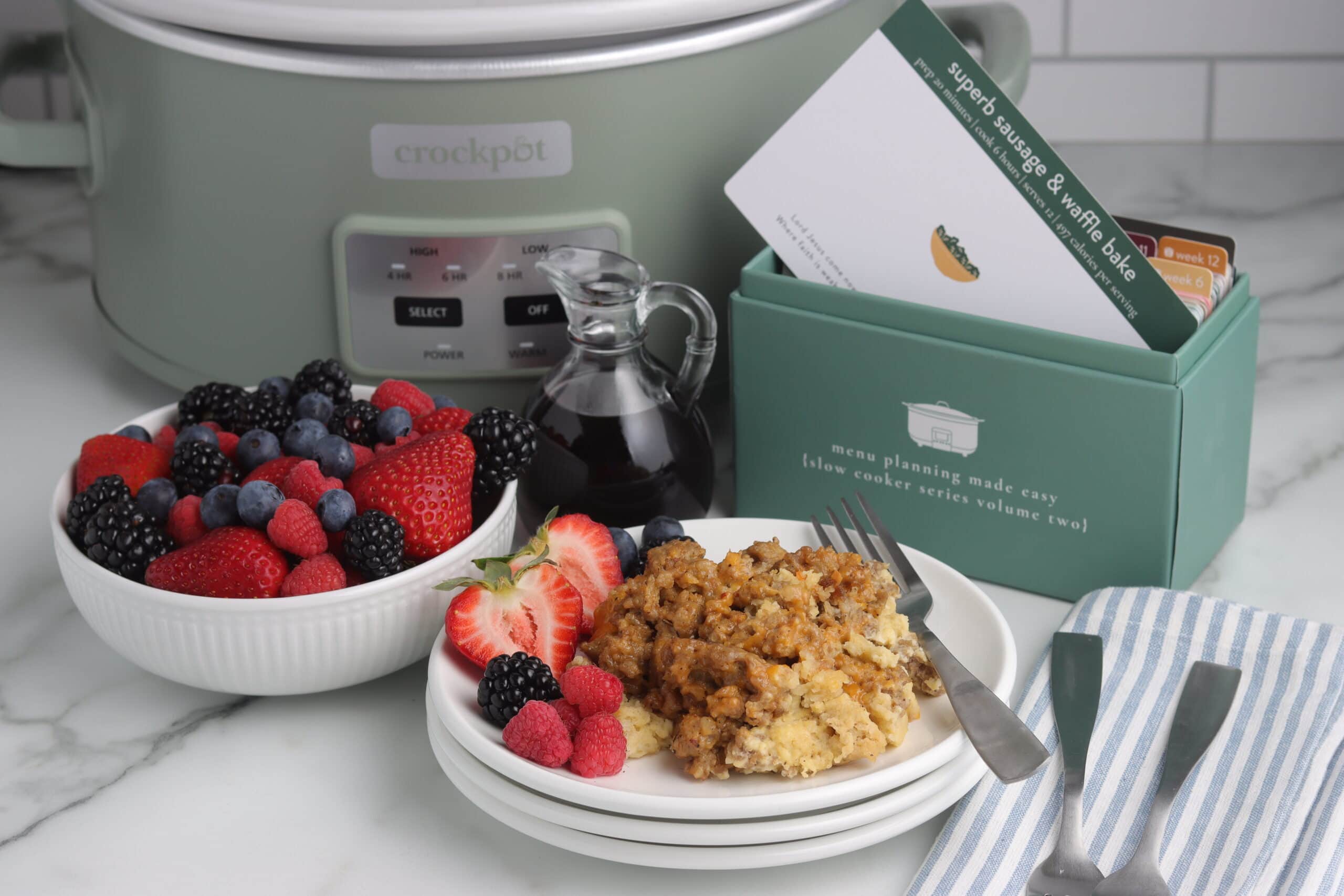 sausage and waffle bake finished on plate with fruit and recipe box sausage and waffle bake finished on plate with fruit and recipe box