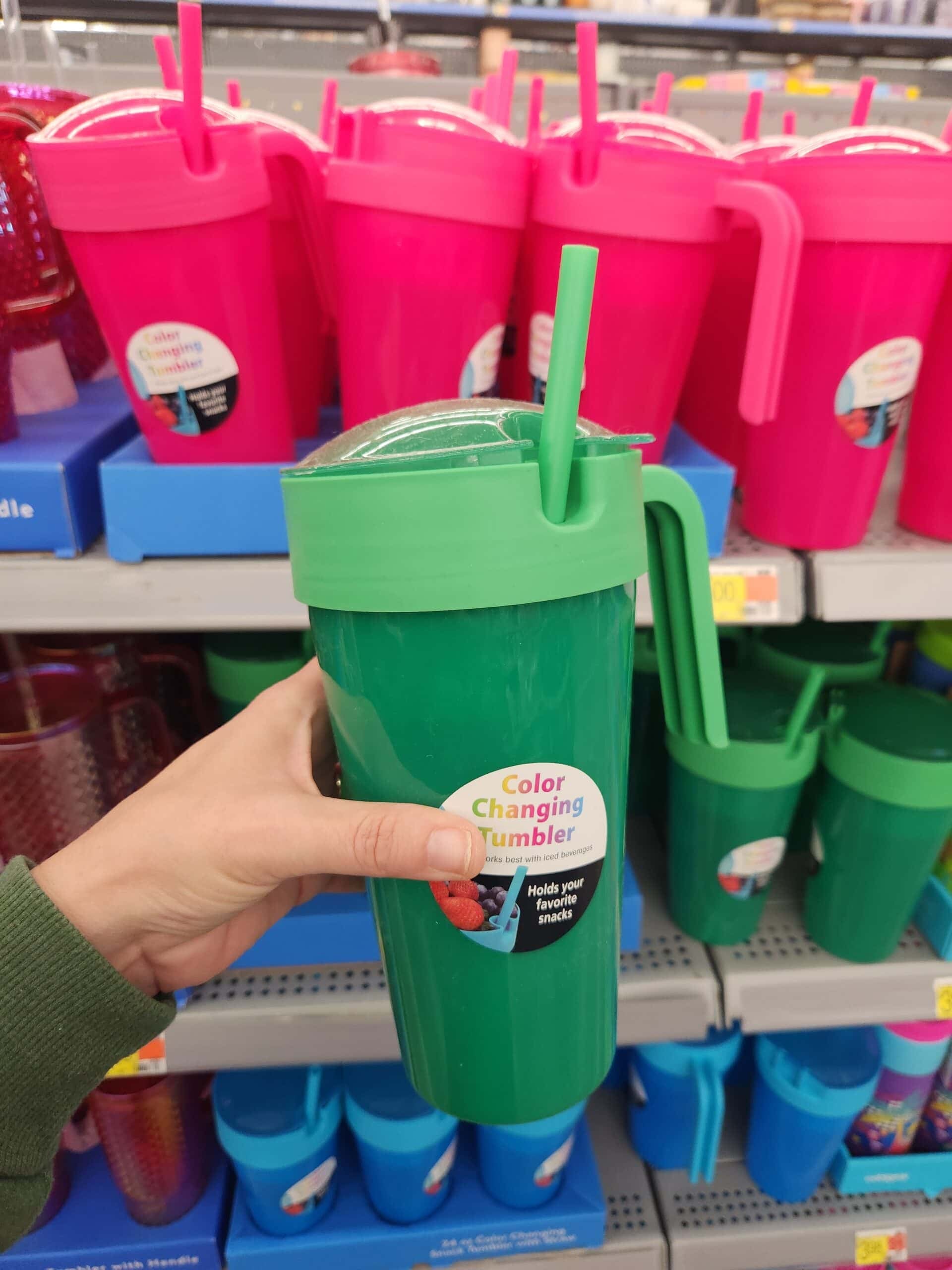 hand holding tumblers