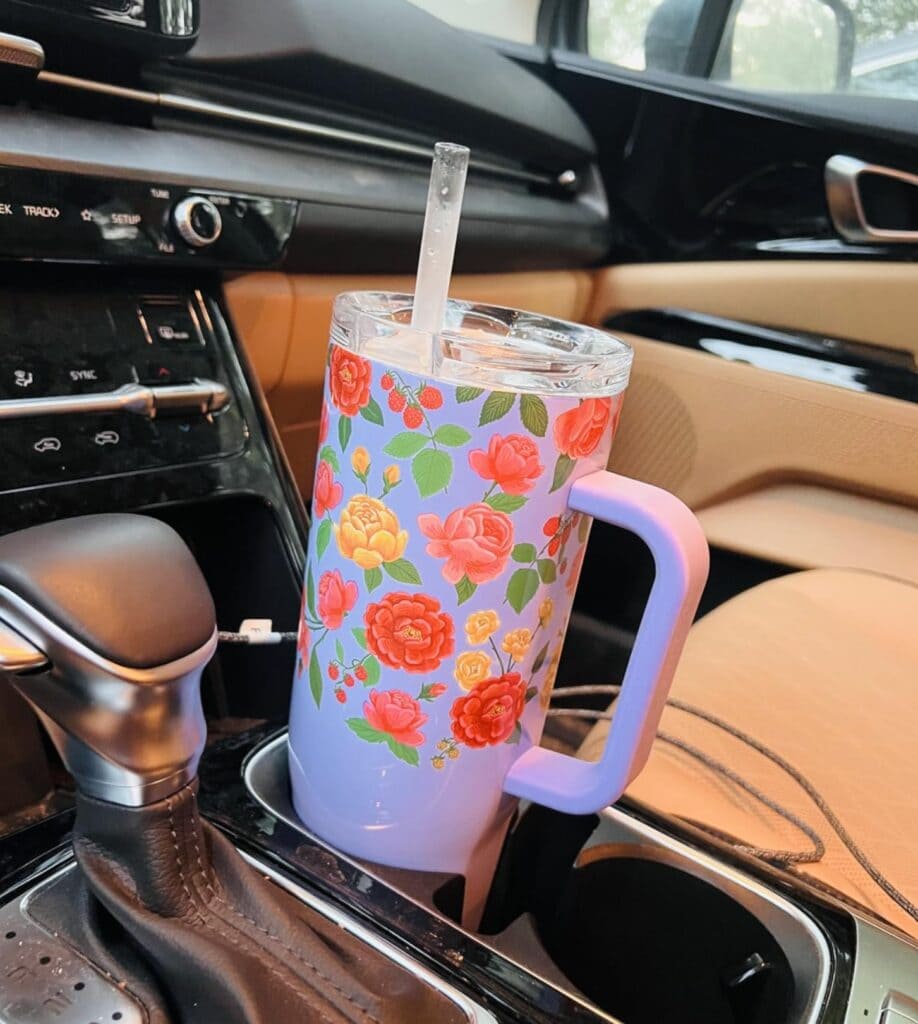 cup in drink holder in car console