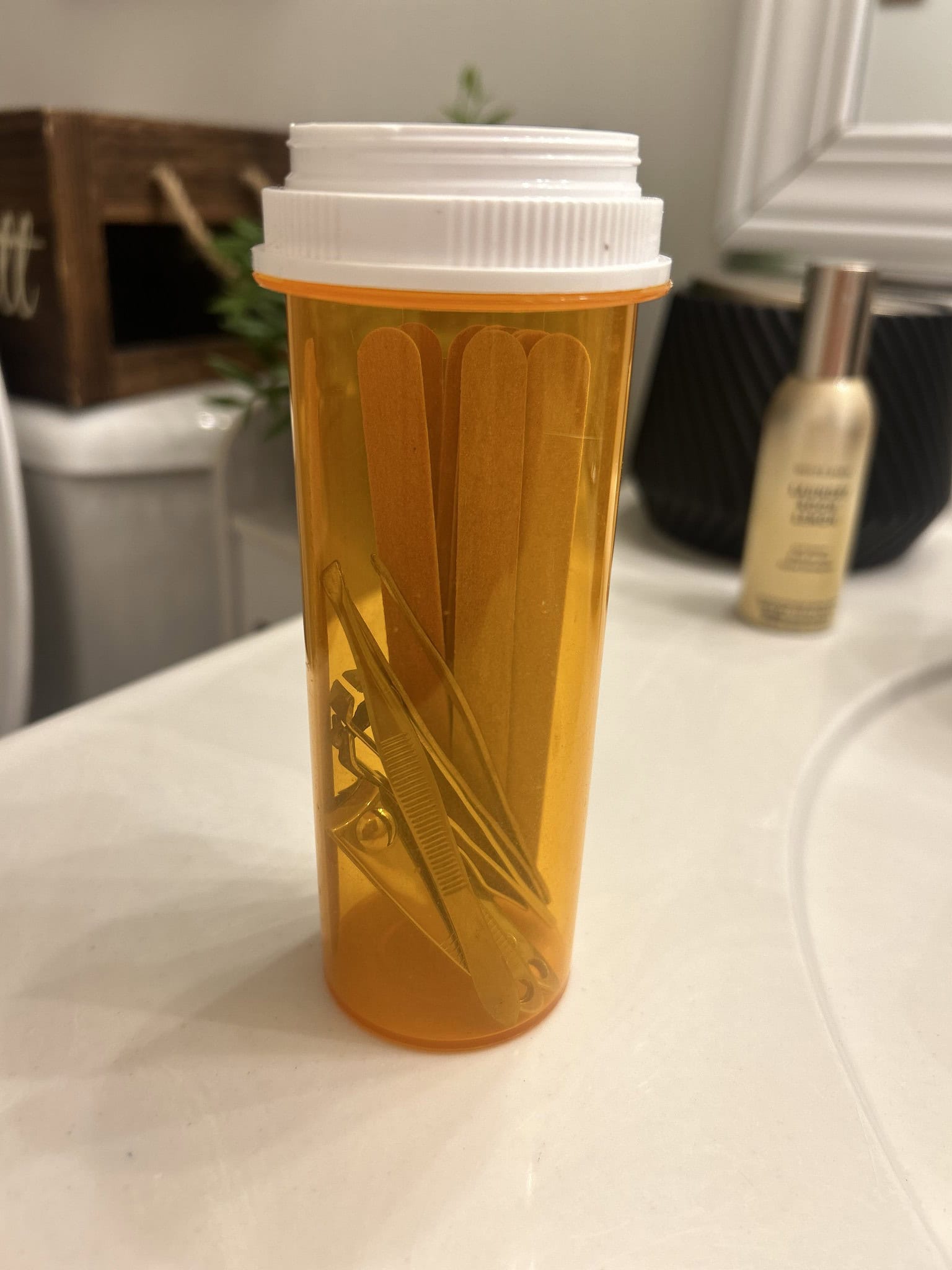 pill bottle storing manicure items 