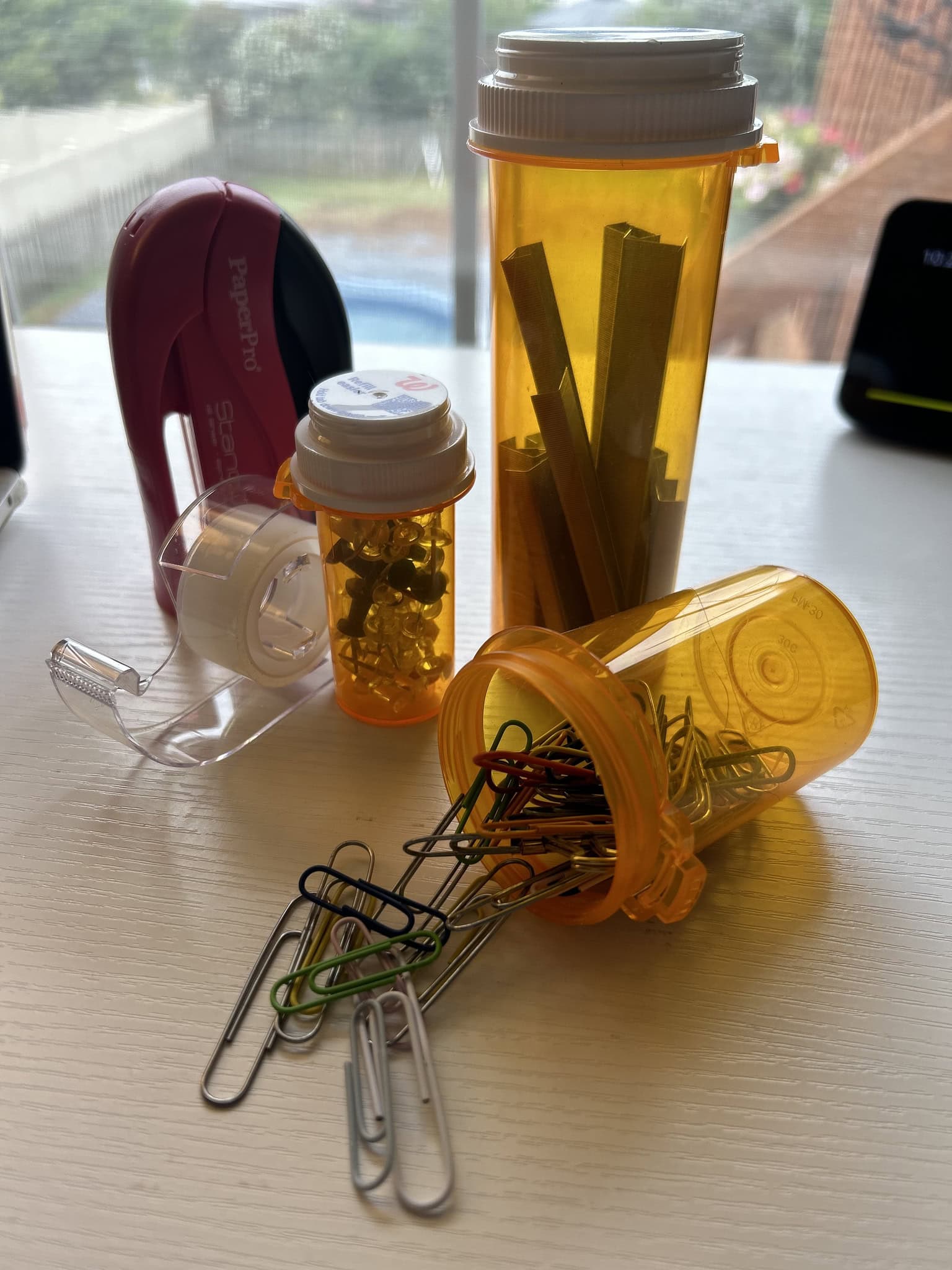 storing office supplies in pill bottles