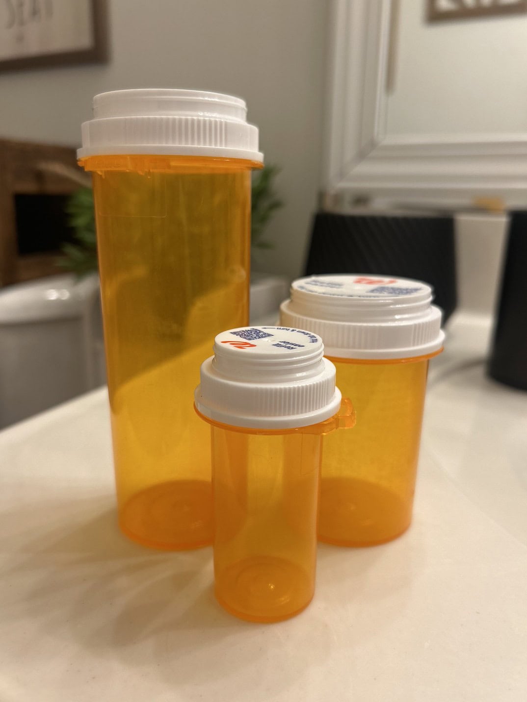 ways to reuse empty pill bottles - pill bottles on counter 