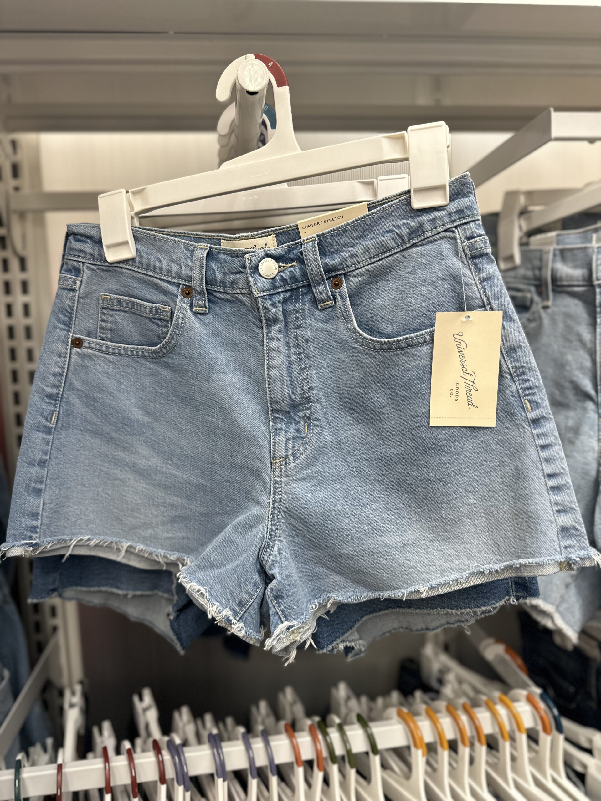target denim shorts hanging on rack
