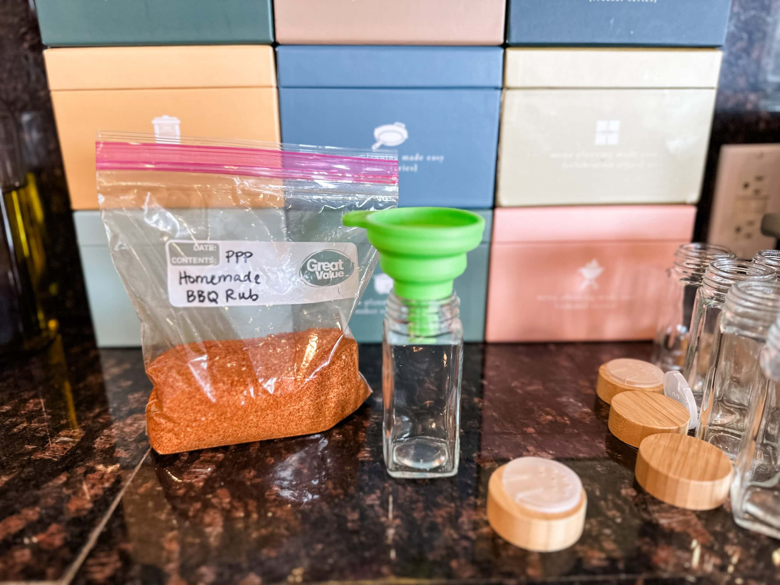 filling spice jars with a funnel