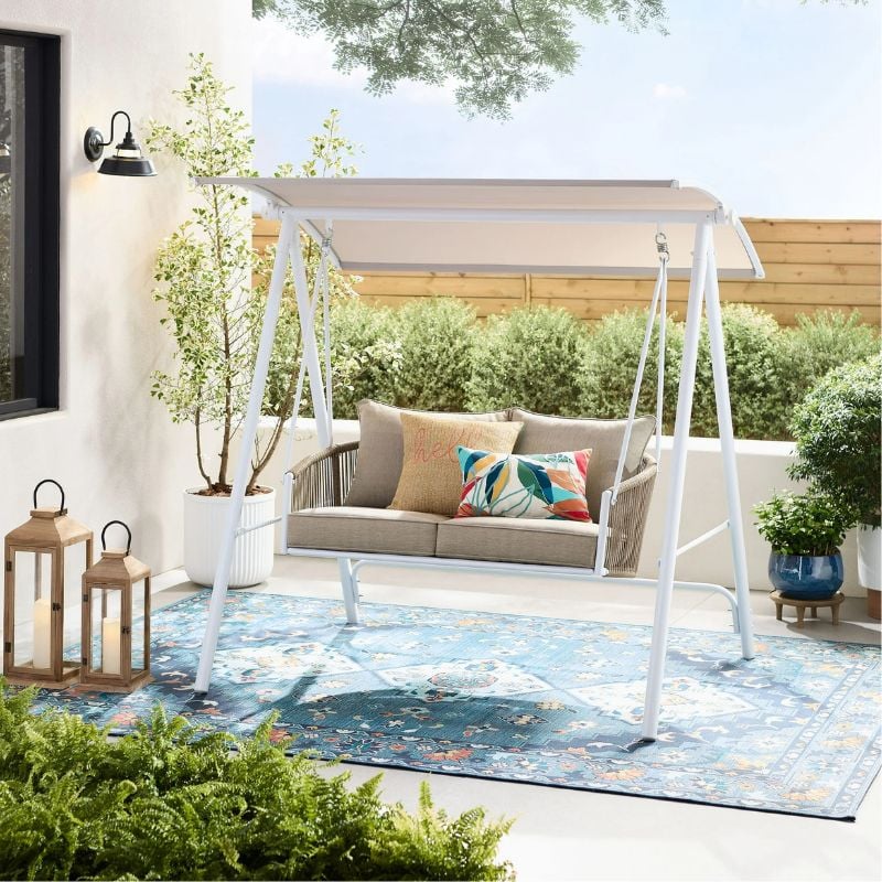 porch swing with canopy on patio