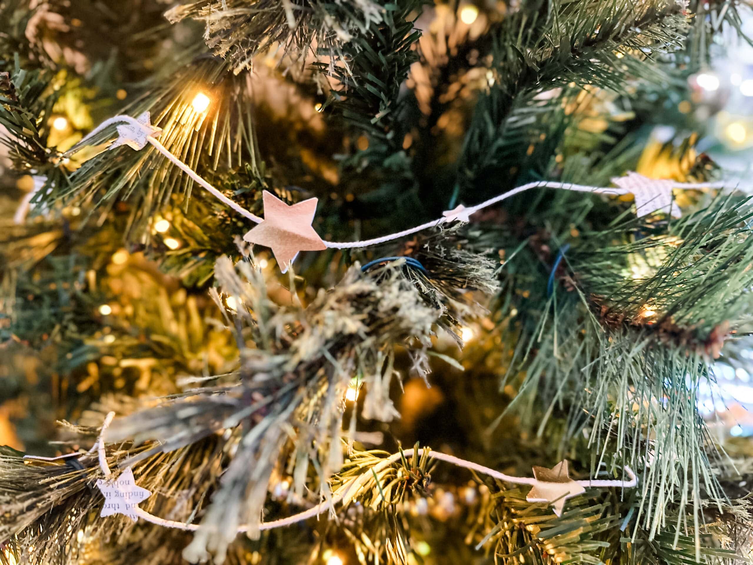 finished star paper garland on christmas tree 