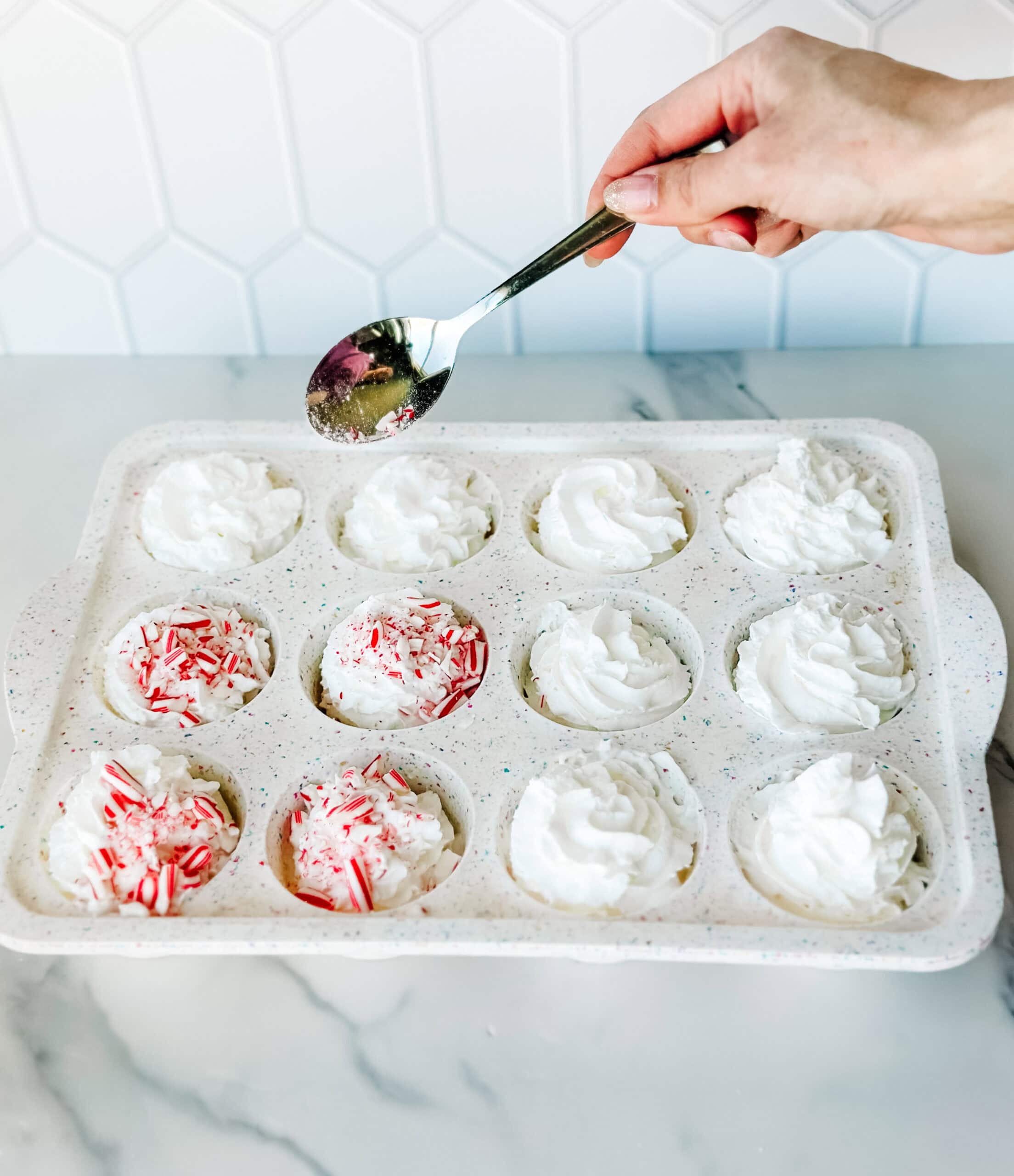 Decorating hot cocoa clouds with peppermint 