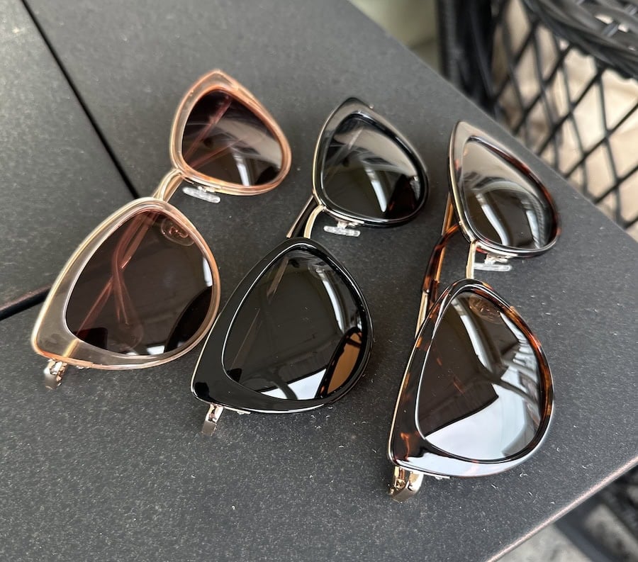 3 styles of sunglasses on table