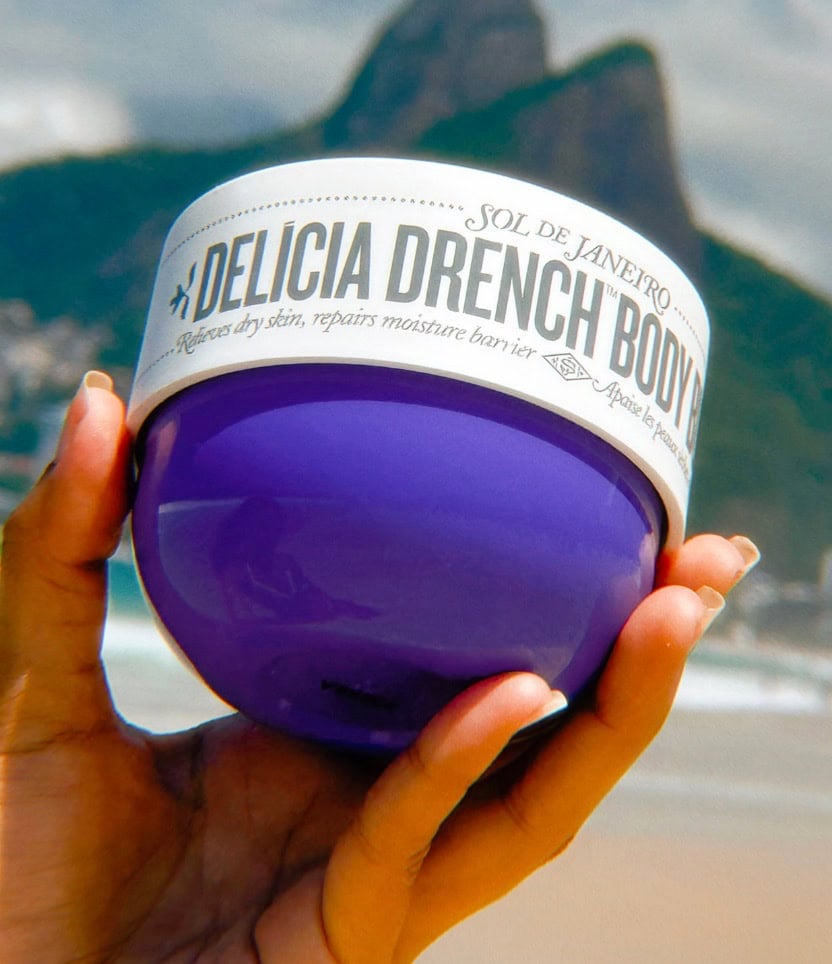 hand holding sol de janeiro delica drench body butter