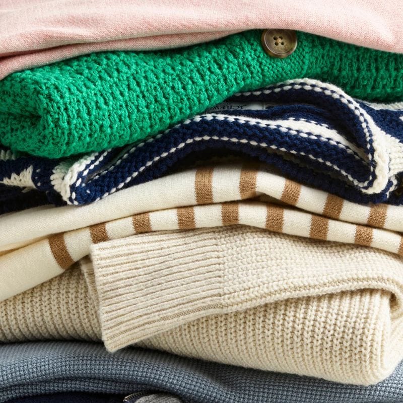 folded piles of j.crew clothing