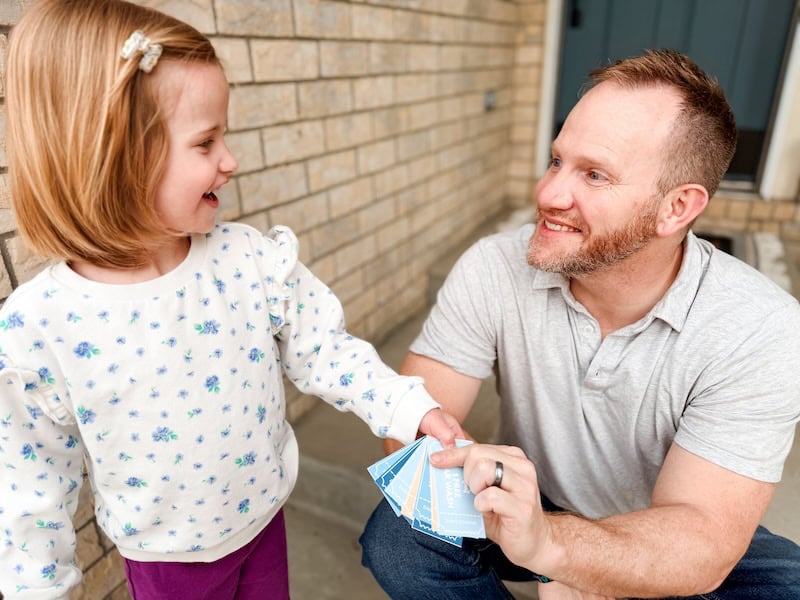 daughter gifting father's day coupon book