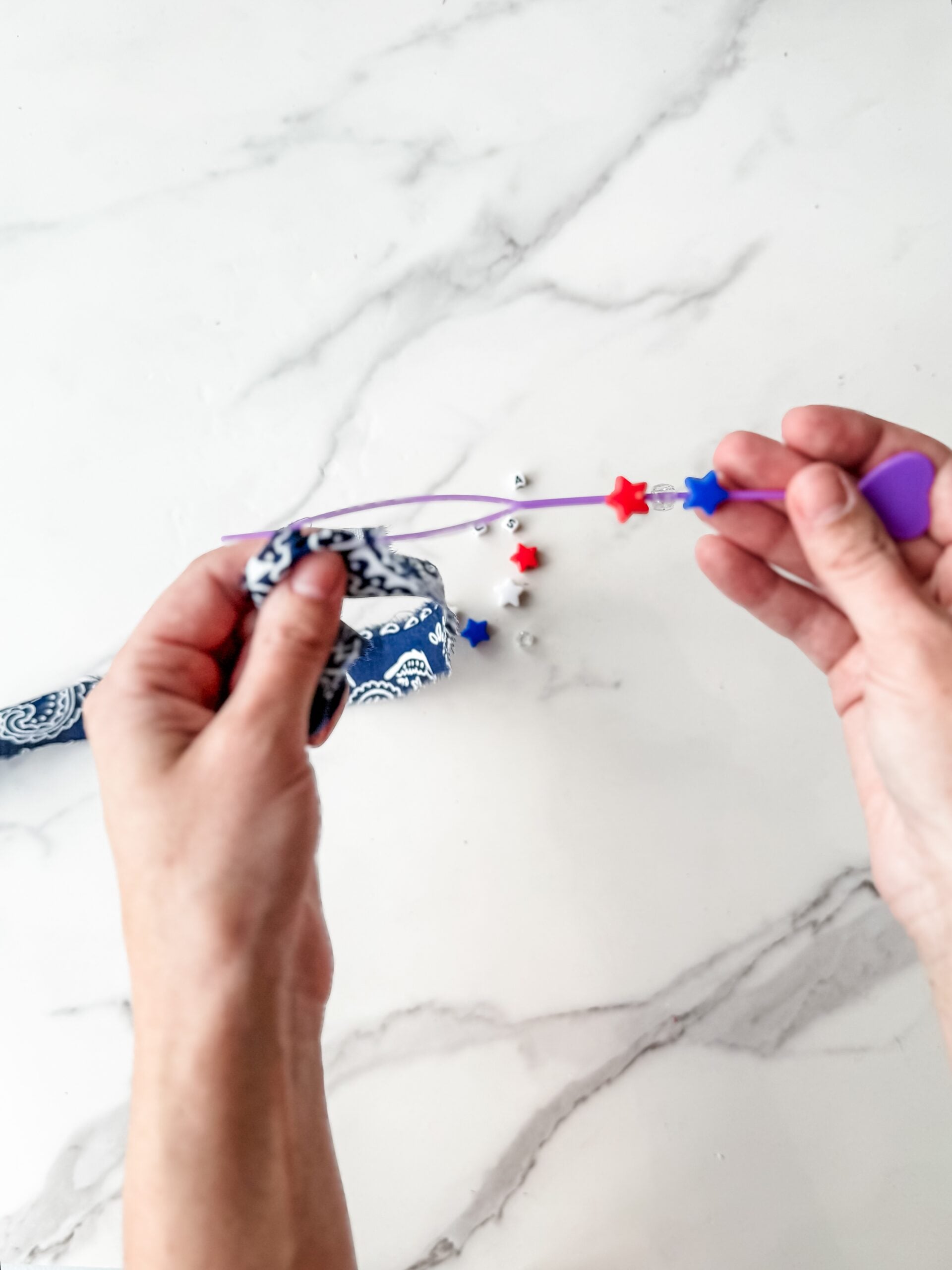adding beads to bandana bracelet 
