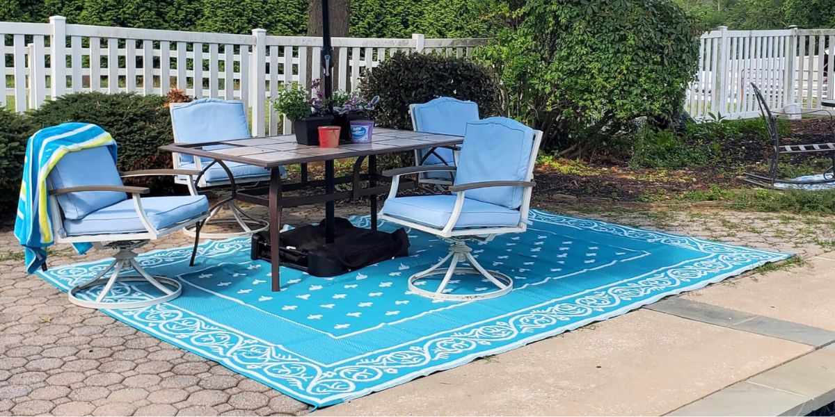 blue patterned area rug on patio