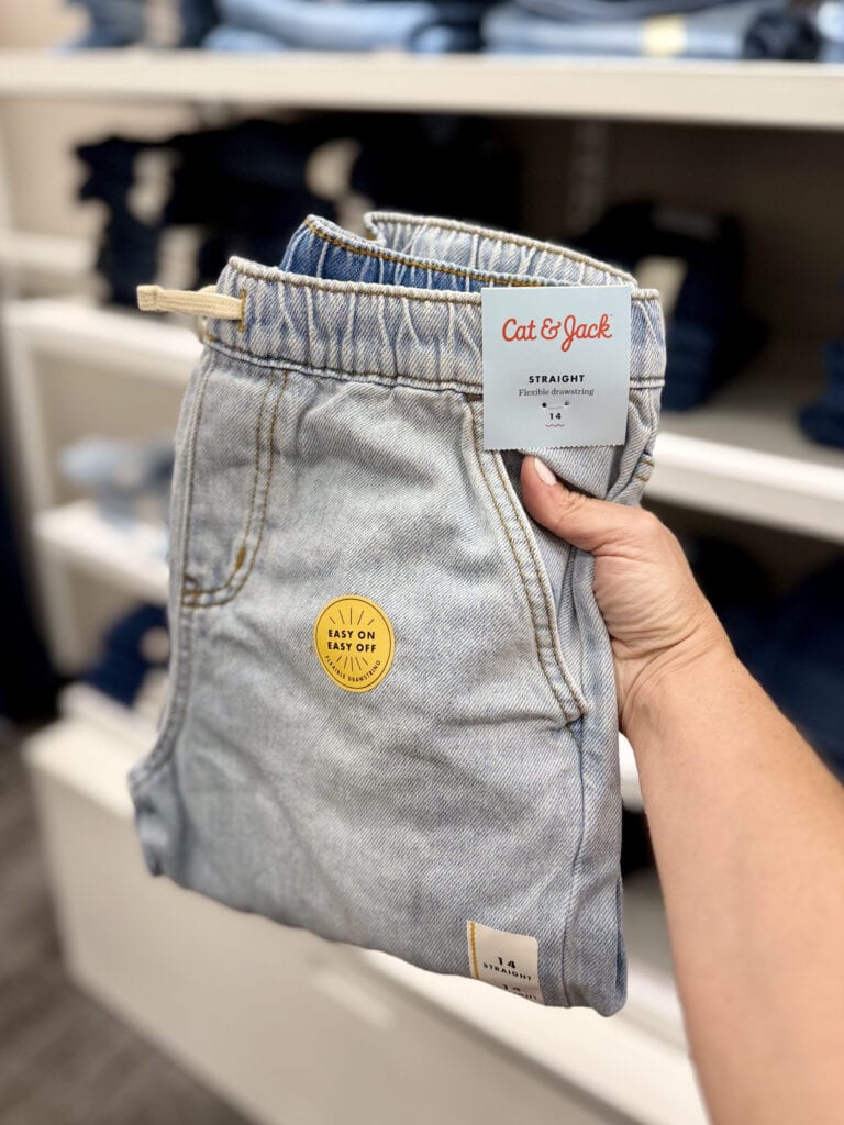 person holding cat & jack jeans