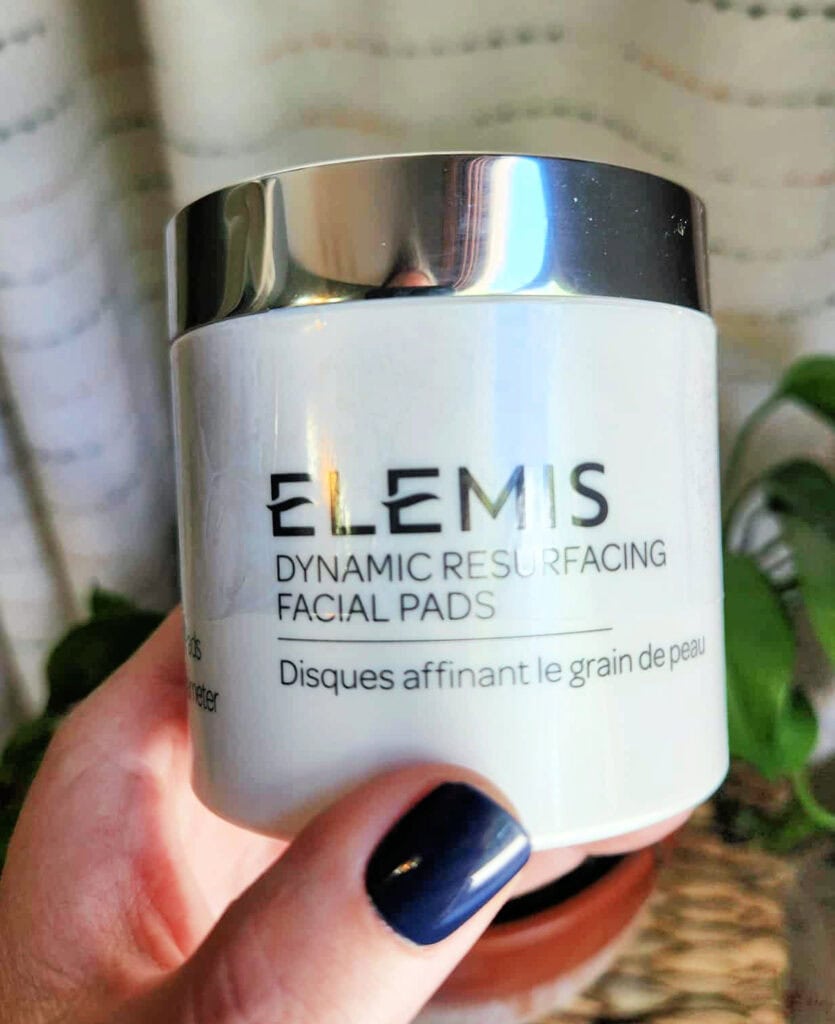 hand holding elemis facial pads